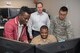 Standing, from left, Kofi Forson, product manager, James Dentice, system engineer, and Capt. Traeyoung Lee, program manager, all from Program Executive Office Digital, work with Master Chief Kristopher Boyd, an information systems technician and spectrum manager with the USS Nimitz Carrier Strike Group 11, at the Hanscom Collaboration and Innovation Center, Hanscom Air Force Base, Mass., May 16, 2019. Sailors from the Nimitz worked with Digital at the Hanscom Collaboration and Innovation Center to test options for this a single hub for intelligence, surveillance and reconnaissance between separate Distributed Common Ground Systems. (U.S. Air Force photo by Jerry Saslav)