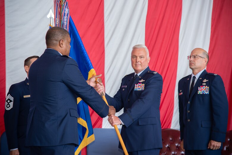 Col. Scott McLaughlin, incoming 349th Air Mobility Wing commander, accepts the guidon from Col. Robert Blake, 4th Air Force vice commander, during a change of command ceremony at Travis Air Force Base, California, June 1, 2019.  McLaughlin is schedule to assume command of the 349th AMW from Col. Raymond Kozak on June 9.