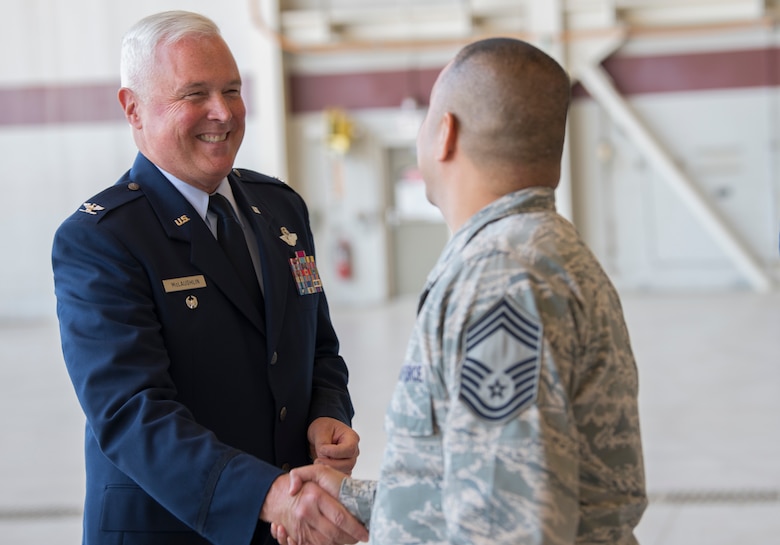 Col. Scott McLaughlin, incoming 349th Air Mobility Wing commander, greets members of the 349th AMW after a change of command ceremony at Travis Air Force Base, California, June 1, 2019. McLaughlin is schedule to assume command of the 349th AMW from Col. Raymond Kozak on June 9.