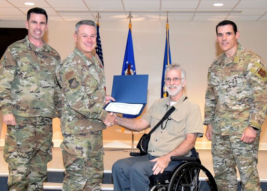 May was recognized in a special ceremony with other members of the wing with over 20 years of service.