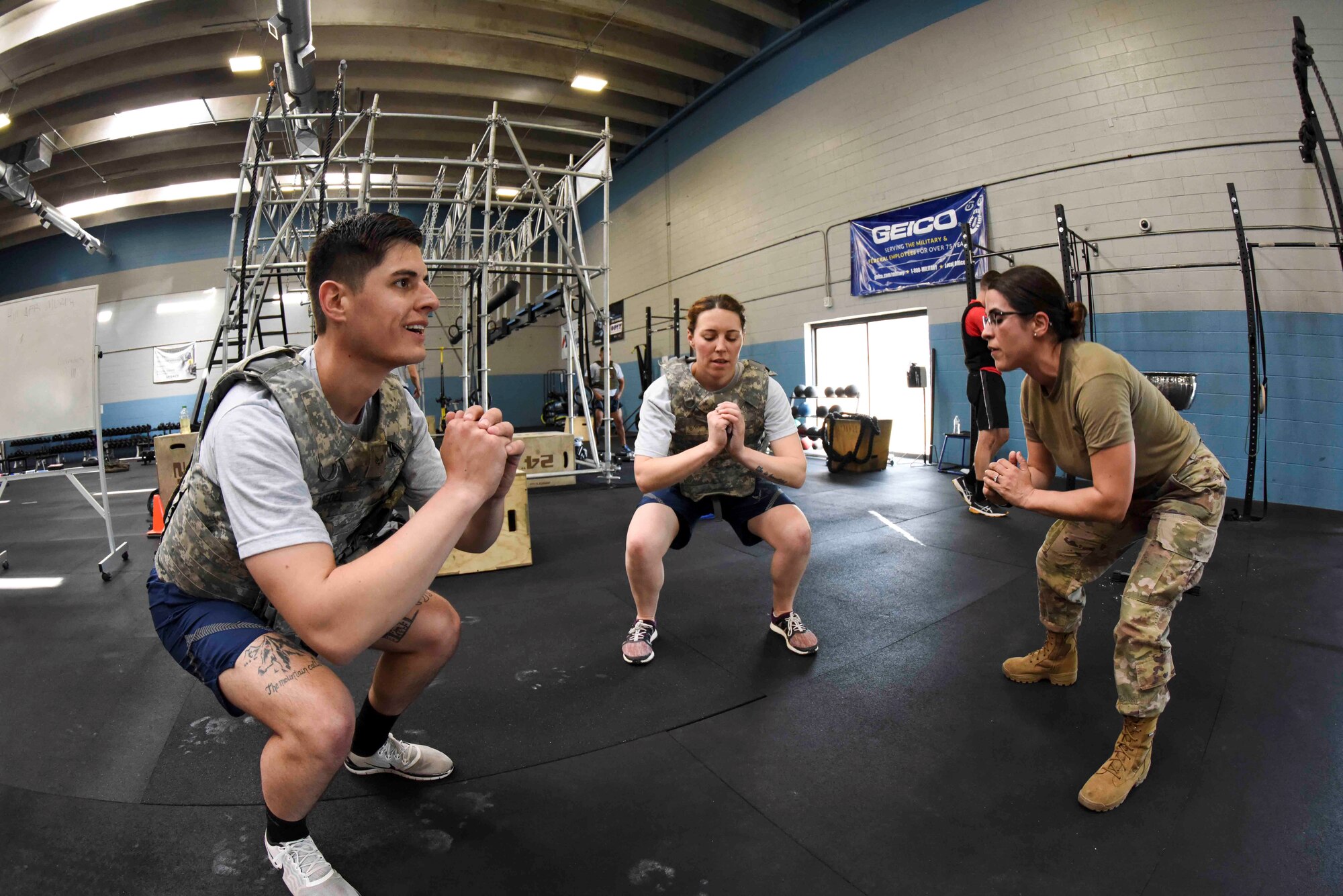 Reservists from the 419th Security Forces Squadron come together as a team to complete the air squat portion of the Murph Challenge