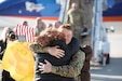 Members of the 65th Field Artillery greet the awaiting crowd upon their return from a Middle East deployment Jan 31 to the Rolland R. Wright Air Base, Salt Lake City.