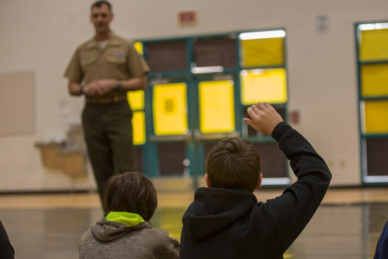 U.S. Marines assigned to Marine Air Control Squadron (MACS) 1 participate in MACS-1's Marine Week at Ron Watson Middle School in Yuma, Ariz., March 27, 2019. The first day of Marine Week consisted of opening remarks from the MACS-1 Commanding Officer, Lt. Col. David Hughes, and demonstrations of the Marine Corps Martial Arts Program (MCMAP) techniques. (U.S. Marine Corps photo by Cpl. Sabrina Candiaflores)