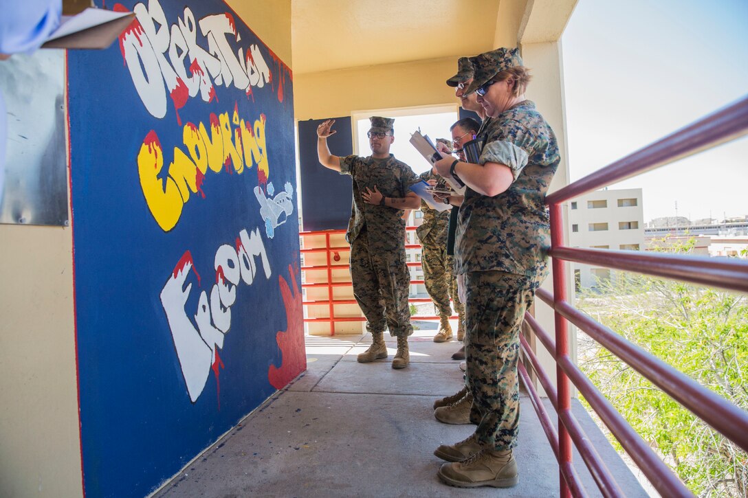 U.S. Marines assigned to Headquarters & Headquarters Squadron (H&HS) participate in a barracks deck competition at the Marine Corps Air Station (MCAS) Yuma H&HS Barracks, March 28, 2019. The Marines had 72 hours to paint and design their deck how they pleased, with rules and guidelines to adhere to. Third deck won the competition with a theme of "Operation Enduring Freedom". (U.S. Marine Corps photo by Cpl. Sabrina Candiaflores)