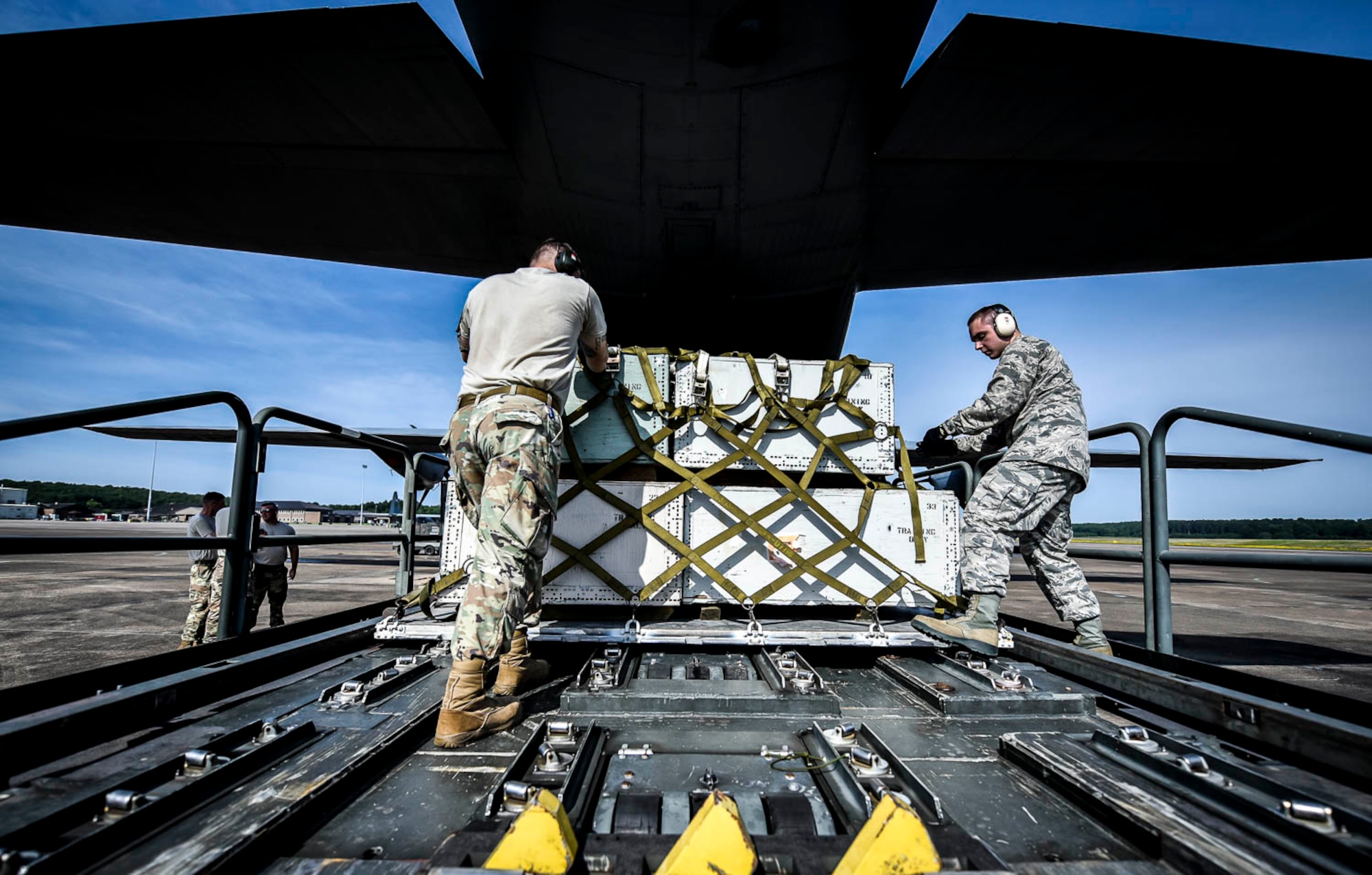 96th Aerial Port Squadron air transportation specialists practice static load training on a C-130J on June 2, 2019 at Little Rock Air Force Base, Ark.