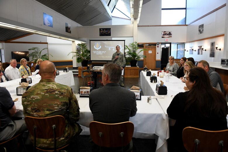 Col. Eric Carney, 97th Air Mobility Wing commander, sits with the honorary commanders during the Honorary Commanders Boot Camp, May 31, 2019, at Altus Air Force Base, Okla. The Honorary Commanders Boot Camp is used to showcase the base’s capabilities and familiarize honorary commanders with their unit’s function on the base. (U.S. Air Force Photo by Senior Airman Jackson N. Haddon)