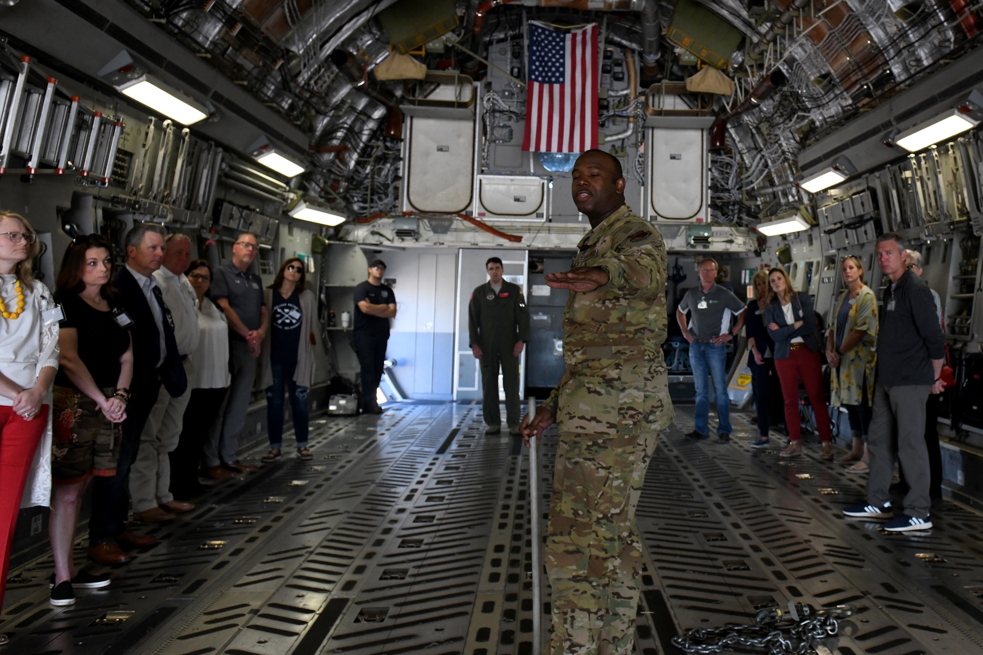 Tech. Sgt. Arthur Wilborn, 58th Airlift Squadron loadmaster, explains the capabilities of the C-17 Globemaster III to honorary commanders during the Honorary Commanders Boot Camp, May 31, 2019, at Altus Air Force Base, Okla. The honorary commanders were guided around the installation in order to provide them a better idea of where their assigned unit fits into the mission of the 97th Air Mobility Wing. (U.S. Air Force Photo by Senior Airman Jackson N. Haddon)