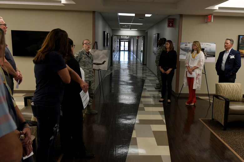 Tech. Sgt. Katelynn Hecht, 97th Medical Operations Squadron Aerospace Medical technician, explains the purpose and mission of the Family Health Section of the Medical Group, May 31, 2019, at Altus Air Force Base, Okla. This was the last stop for the Honorary Commanders Boot Camp before attending the monthly base promotion ceremony. (U.S. Air Force Photo by Senior Airman Jackson N. Haddon)