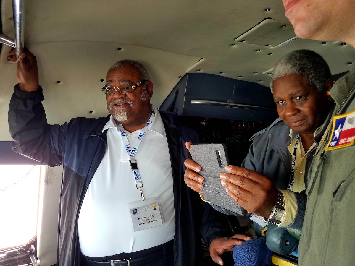 Jerry W. Dailey (left), Macedonia Baptist senior pastor and the Rev. Ruben Archield, Friendship Baptist Church, observe the south Texas landscape from the cockpit of a C-5M Super Galaxy.