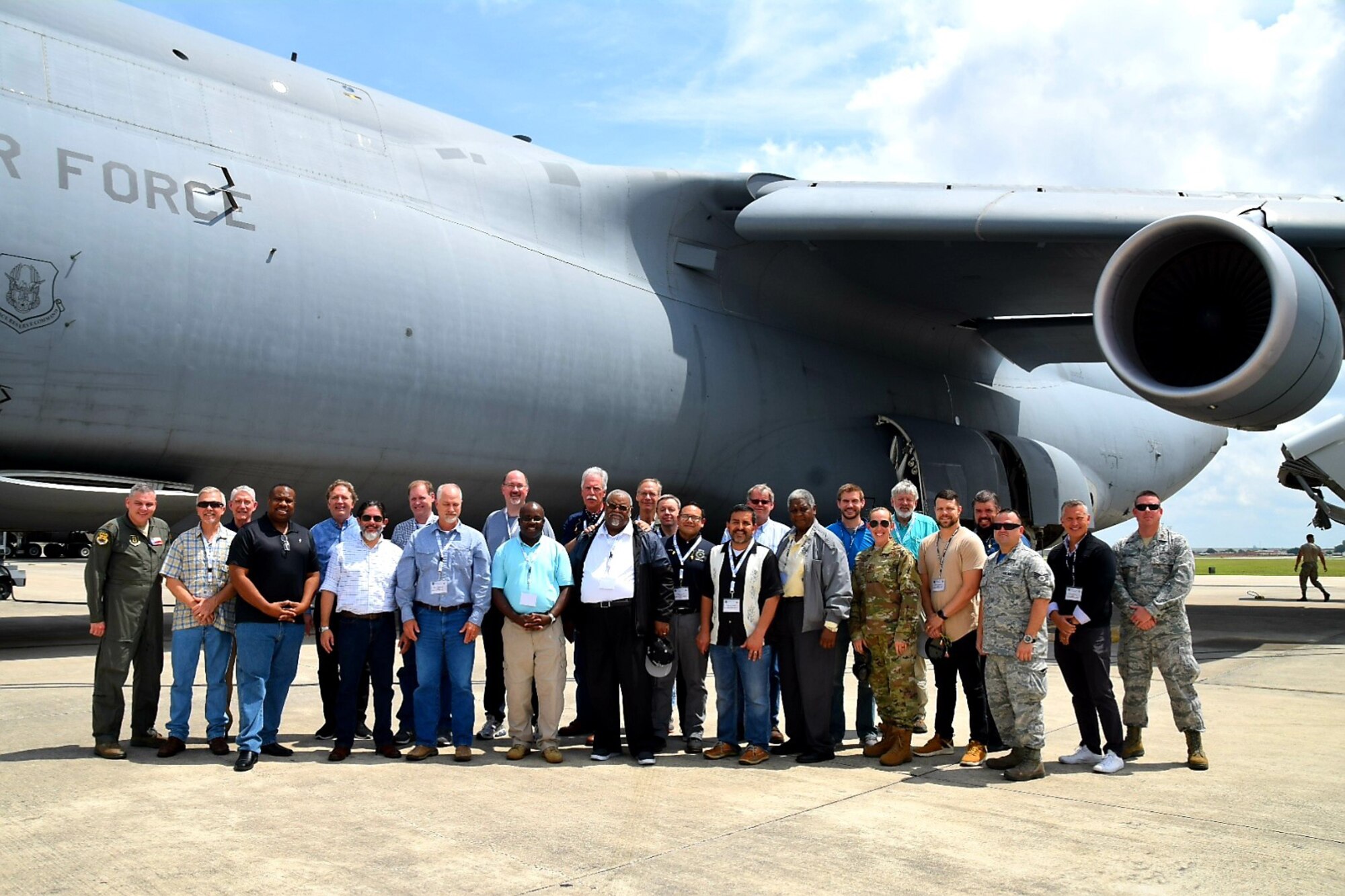 Civilian clergy and their military sponsors pose for a photo in front after a flight on a C-5M Super Galaxy at the 433rd Airlift Wing’s annual Clergy Day flight June 1, 2019, at Joint Base San Antonio-Lackland, Texas.