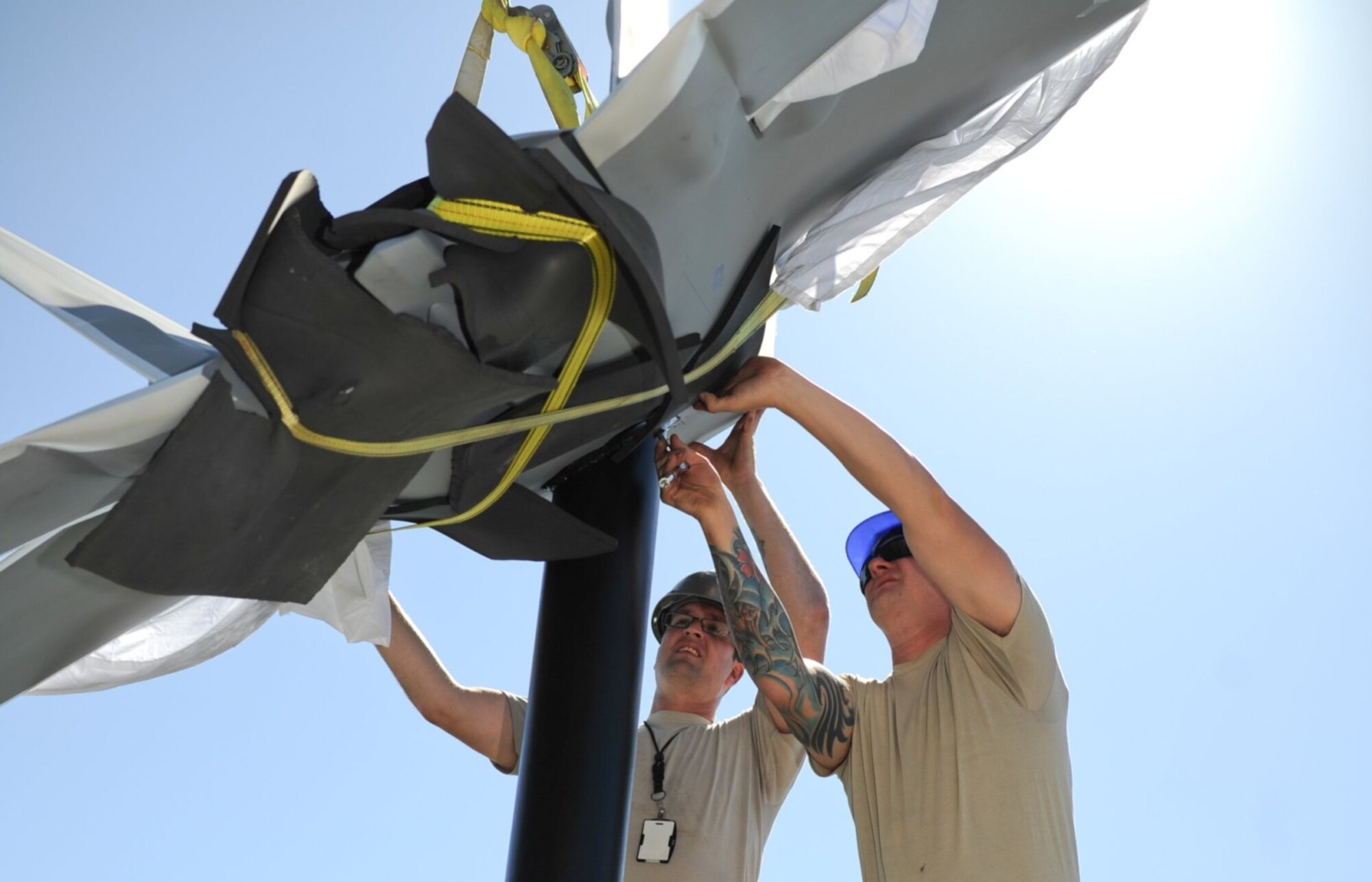 The sculptures represents the schoolhouse for raptor pilot training and are a symbol of Air Dominance.