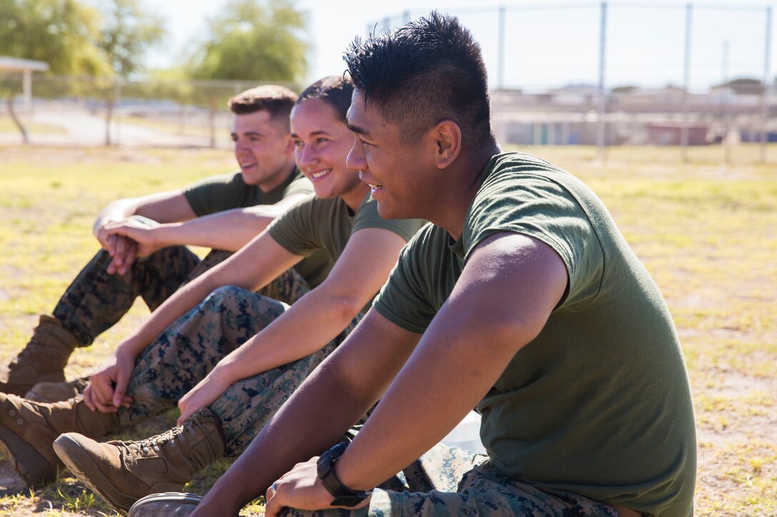 U.S. Marines assigned to Marine Air Control Squadron (MACS) 1 participate in MACS-1's Marine Week at Ron Watson Middle School in Yuma, Ariz., March 29, 2019. The third and last day of Marine Week consisted of students conducting a modified Combat Fitness Test, tasting food from Meal, Ready-to-Eat (MRE), trying on Marine Corps equipment; flak jackets, gas masks, etc., and interacting with the Marines. (U.S. Marine Corps photo by Cpl. Sabrina Candiaflores)