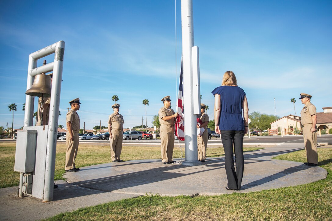 U.S. Navy Chiefs aboard Marine Corps Air Station (MCAS) Yuma observe morning colors on the station's parade deck, April 1, 2019 in celebration of the 126th Birthday of the Chief Petty Officer. The Corpsmen raised the flag at half-staff in honor of Maj. Matthew M. Wiegand and Capt. Travis W. Brannon, the two Marine Corps pilots killed in the AH-1Z Viper Helicopter crash March 30, 2019. (U.S. Marine Corps photo by Cpl. Sabrina Candiaflores)
