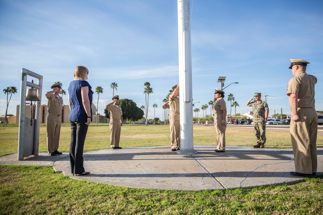 U.S. Navy Chiefs aboard Marine Corps Air Station (MCAS) Yuma observe morning colors on the station's parade deck, April 1, 2019 in celebration of the 126th Birthday of the Chief Petty Officer. The Corpsmen raised the flag at half-staff in honor of Maj. Matthew M. Wiegand and Capt. Travis W. Brannon, the two Marine Corps pilots killed in the AH-1Z Viper Helicopter crash March 30, 2019. (U.S. Marine Corps photo by Cpl. Sabrina Candiaflores)