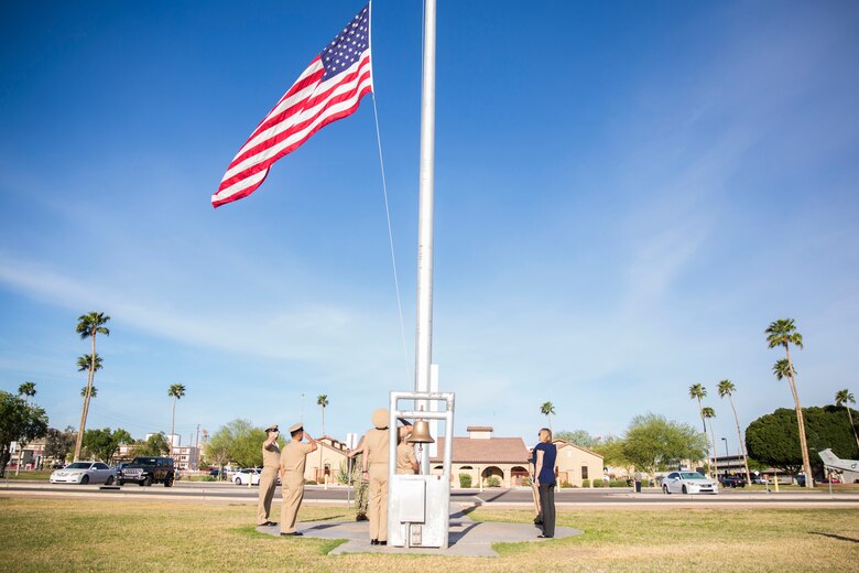 U.S. Navy Chiefs aboard Marine Corps Air Station (MCAS) Yuma observe morning colors on the station's parade deck, April 1, 2019 in celebration of the 126th Birthday of the Chief Petty Officer. The Corpsmen raised the flag at half-staff in honor of Maj. Matthew M. Wiegand and Capt. Travis W. Brannon, the two Marine Corps pilots killed in the AH-1Z Viper Helicopter crash March 30, 2019. (U.S. Marine Corps photo by Cpl. Sabrina Candiaflores)
