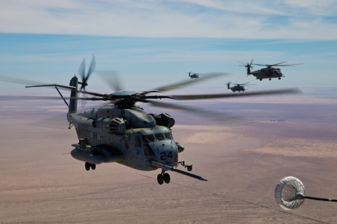 U.S. Marines with Marine Aerial Refuel Squadron VMGR-252 conduct an aerial refuel for a CH-53 in support of Weapons and Tactics Instructor (WTI) course 2-19 in Yuma, Ariz., April 6, 2019. WTI is a seven-week training event which emphasizes operational integration of the six functions of the Marine Corps aviation in support of a Marine Air Ground Task Force. WTI also provides standardized advanced tactical training and certification of unit instructor qualifications to support Marine aviation training readiness and assists in developing and employing aviation weapons and tactics. (U.S. Marine Corps photo by Pfc John Hall)