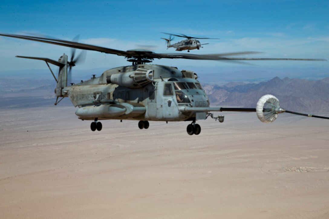 U.S. Marines with Marine Aerial Refuel Squadron VMGR-252 conduct an aerial refuel for a CH-53 in support of Weapons and Tactics Instructor (WTI) course 2-19 in Yuma, Ariz., April 6, 2019. WTI is a seven-week training event which emphasizes operational integration of the six functions of the Marine Corps aviation in support of a Marine Air Ground Task Force. WTI also provides standardized advanced tactical training and certification of unit instructor qualifications to support Marine aviation training readiness and assists in developing and employing aviation weapons and tactics. (U.S. Marine Corps photo by Pfc, John Hall)