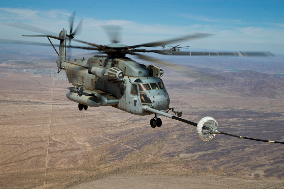 U.S. Marines with Marine Aerial Refuel Squadron VMGR-252 conduct an aerial refuel for a CH-53 in support of Weapons and Tactics Instructor (WTI) course 2-19 in Yuma, Ariz., April 6, 2019. WTI is a seven-week training event which emphasizes operational integration of the six functions of the Marine Corps aviation in support of a Marine Air Ground Task Force. WTI also provides standardized advanced tactical training and certification of unit instructor qualifications to support Marine aviation training readiness and assists in developing and employing aviation weapons and tactics. (U.S. Marine Corps photo by Pfc John Hall)