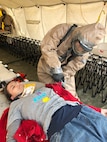 Members of the Utah National Guard provide assistance following a nuclear fallout scenario exercise at Camp Williams in Bluffdale to showcase the Homeland Response Force’s capabilities on Saturday, March 23, 2019. The training involved drills on on responding to a 10-kiloton nuclear blast and included rescue, extraction, decontamination and medical attention.