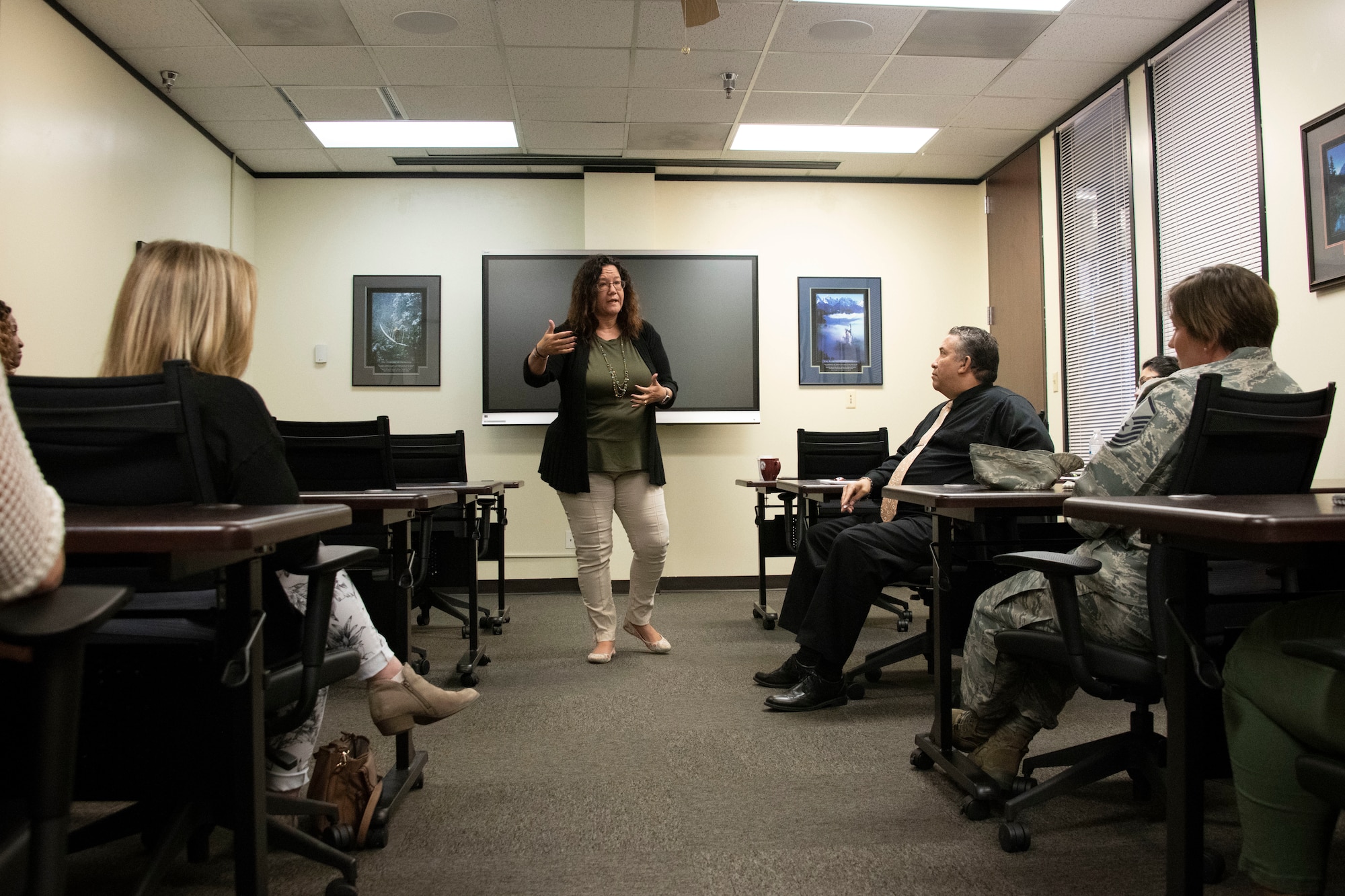 Danna Plewe, Air Force Employee Assistance Program (AF EAP) Manager, talks to members of the 97th Force Support Squadron Airman and Family Readiness Center (A&FRC) about the AF EAP