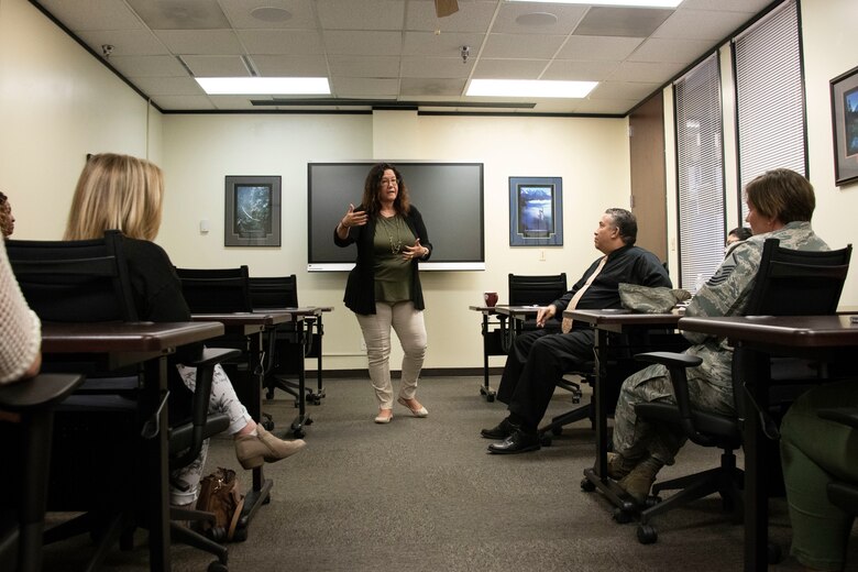 Danna Plewe, Air Force Employee Assistance Program (AF EAP) Manager, talks to members of the 97th Force Support Squadron Airman and Family Readiness Center (A&FRC) about the AF EAP