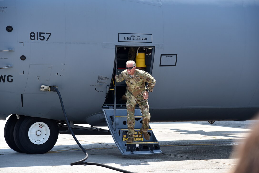 Lt. Col. Keith Gibson, 403rd Operations Group deputy commander, disembarks a C-130J Super Hercules aircraft June 4, 2019 at Keesler Air Force Base, Miss. Gibson was greeted by family and friends after completing his is final flight. (U.S. Air Force photo by Tech. Sgt. Christopher Carranza)