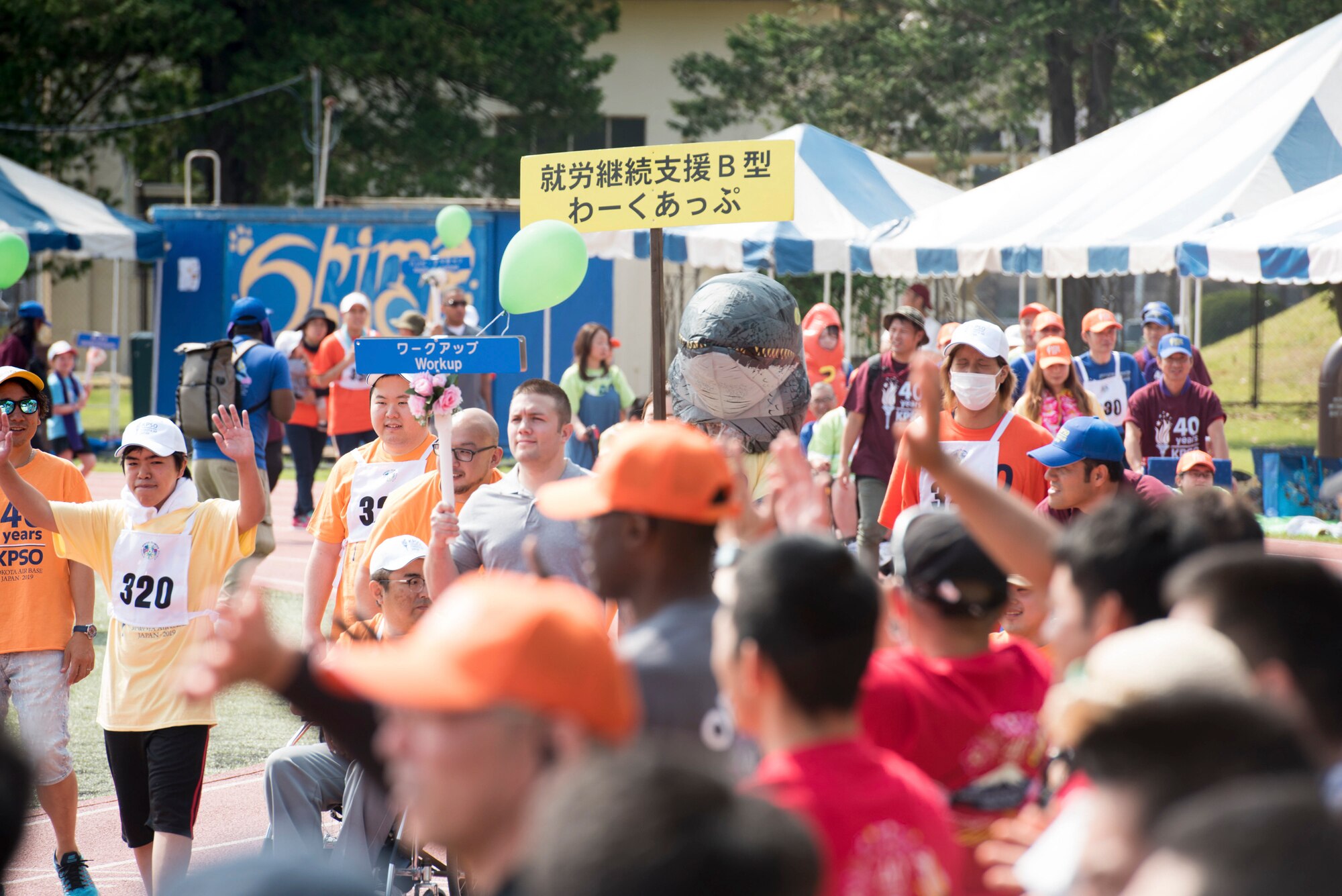 Athletes, their buddies and coaches march in the opening parade of the Kanto Plains Special Olympics at Yokota Air Base, Japan, June 1, 2019
