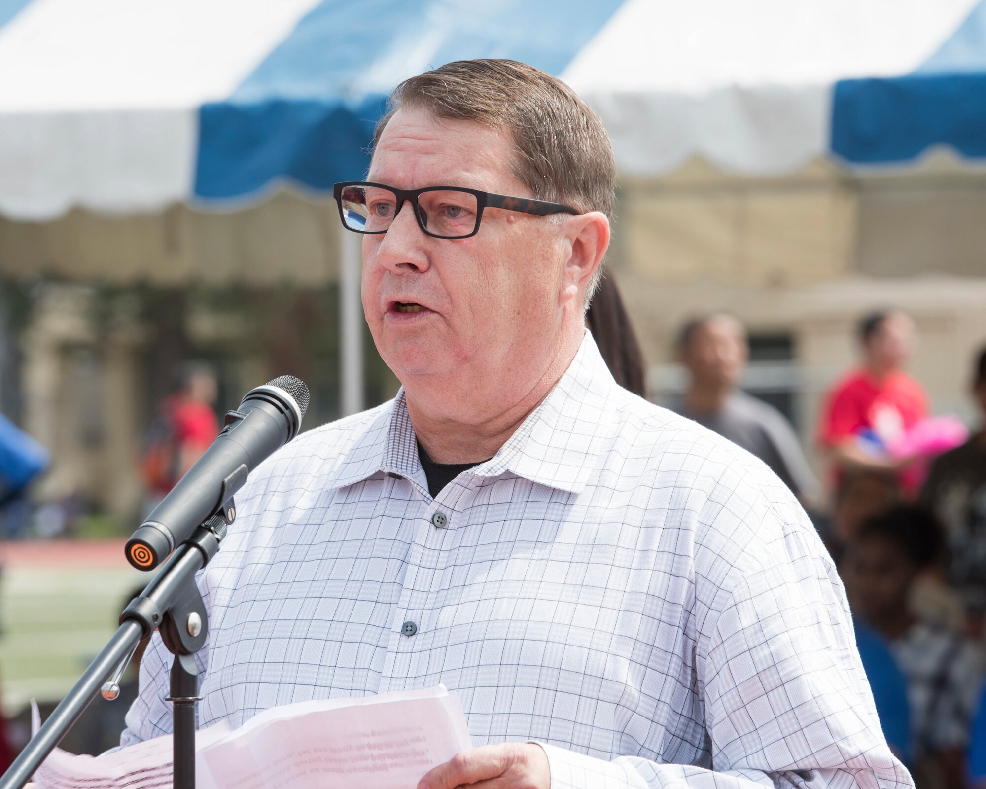 Raymond Denny, an establishing member of the Kanto Plains Special Olympics 40 years ago, gives a speech at the KPSO opening ceremony at Yokota Air Base, Japan, June 1, 2019.