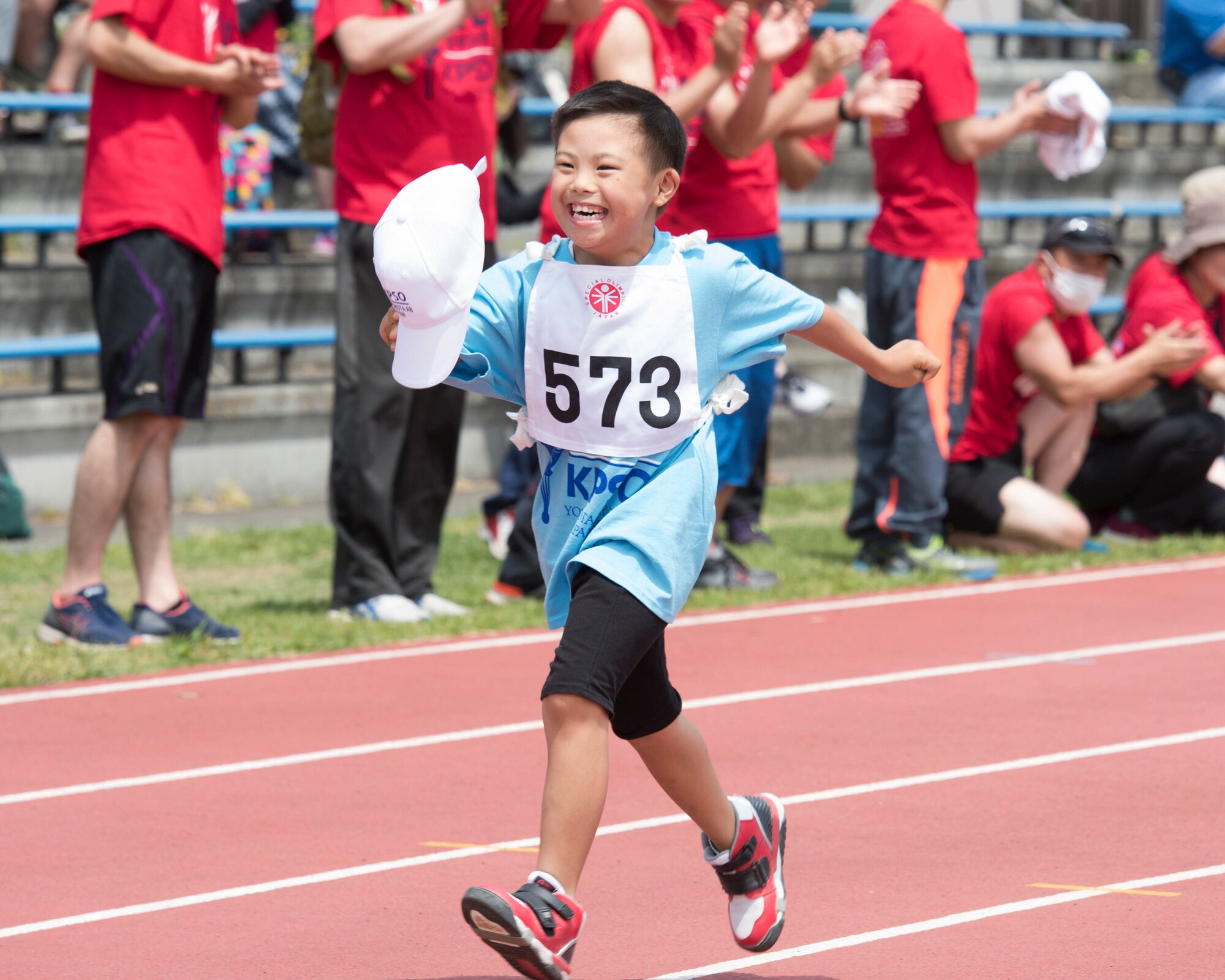 An athlete sprints to the finish line in the 50 meter race during the 40th Annual Kanto Plains Special Olympics at Yokota Air Base, Japan, June 1, 2019.