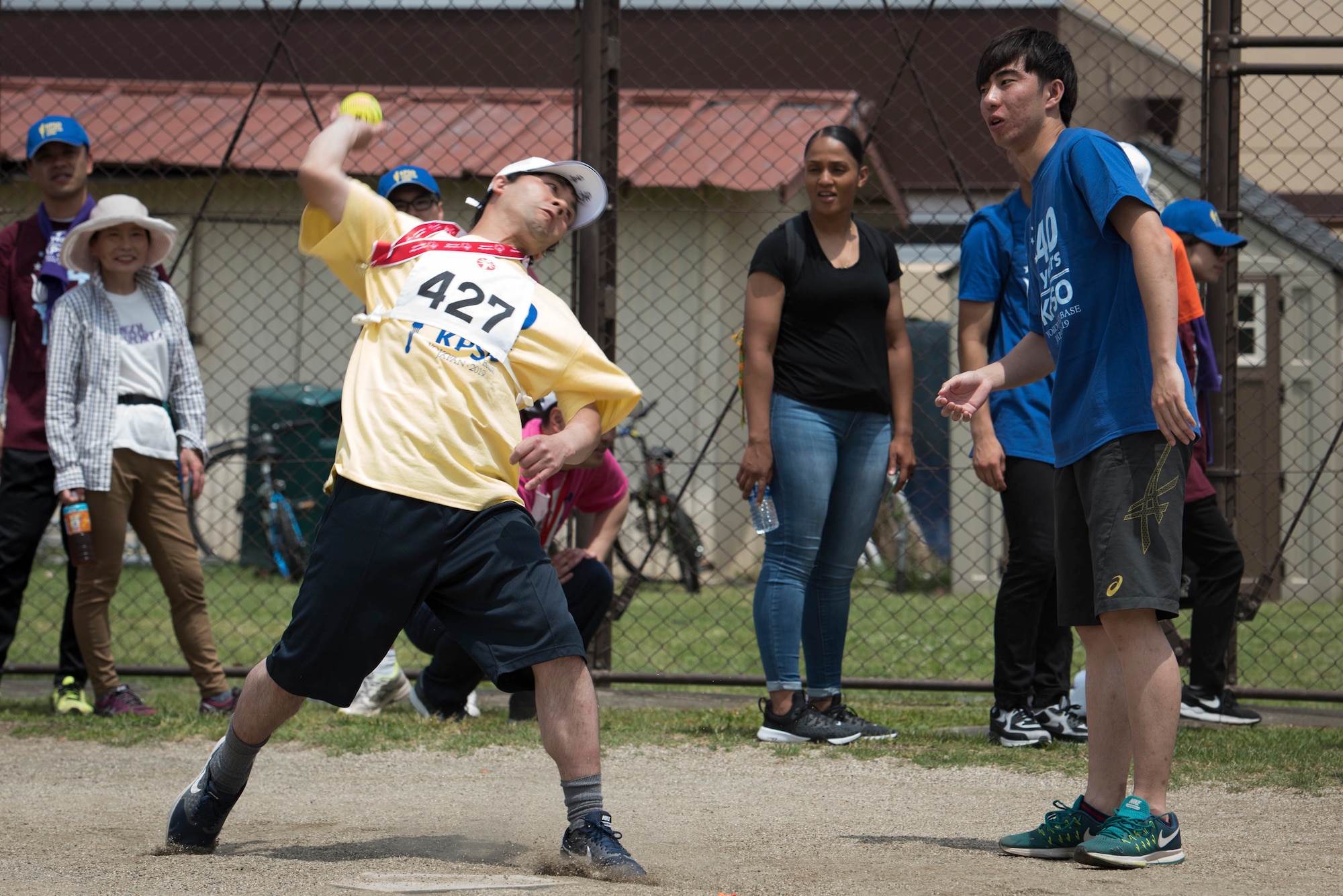 An athlete throws a ball during the softball throw competition of the Kanto Plains Special Olympics at Yokota Air Base, Japan, June 1, 2019.