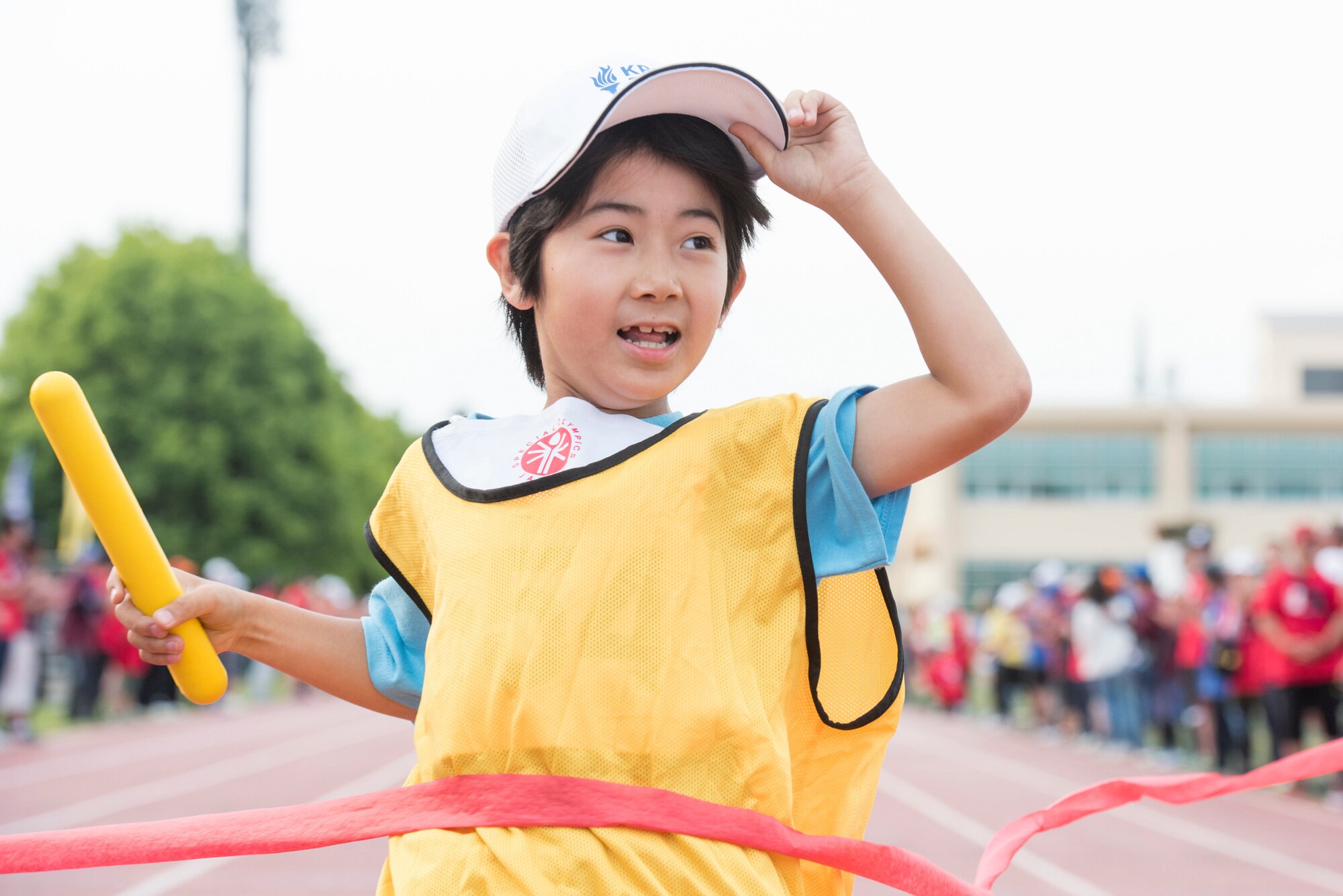 An athlete crosses the finish line during the 400 meter relay race at the 40th Annual Kanto Plains Special Olympics at Yokota Air Base, Japan, June 1, 2019.
