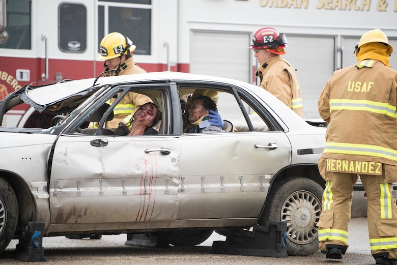 30th Space Wing firefighters arrive on scene during a DUI production reenactment during Spring Wingman Day May 23, 2019, at Vandenberg Air Force Base, Calif. The production highlighted the potential consequences of driving under the influence and the damage it can do to those around you. (U.S. Air Force photo by Airman 1st Class Hanah Abercrombie)