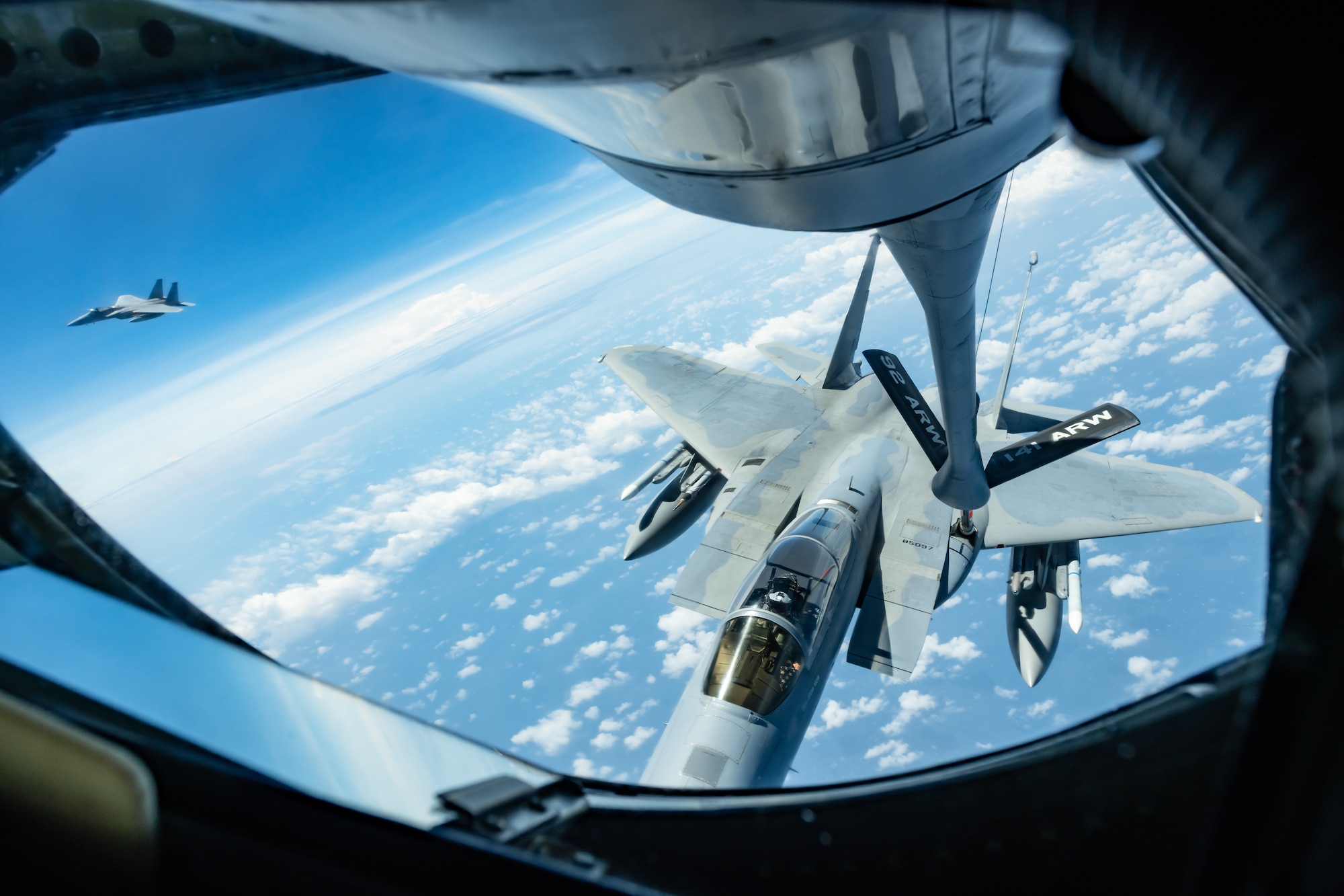 An F-15C Eagle from the 44th Fighter Squadron refuels with a KC-135 Stratotanker from the 909th Air Refuleing Squadron April 15, 2019, during a routine training exercise out of Kadena Air Base, Japan. The 909th ARS helps ensure a free-and-open Indo-Pacific by providing air refueling to U.S., allies and partners within the area of responsibility. (U.S. Air Force photo by Airman 1st Class Matthew Seefeldt)