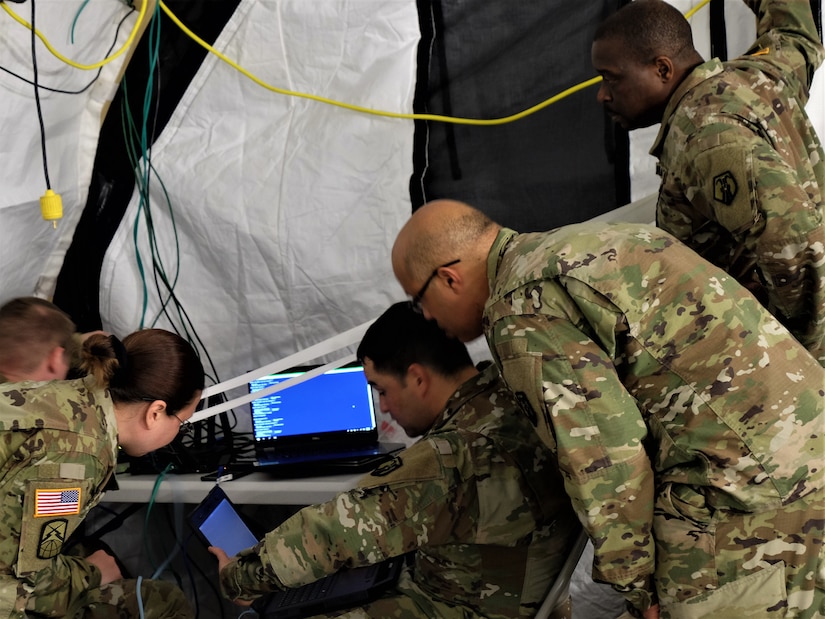 KAISERSLAUTERN, Germany – Soldiers in the G6 section set up and monitor network capabilities for the command post exercise during the 7th MSC’s Annual Training at Daenner Kaserne May 30 to June 4, 2019. (US Army photo by Sgt. Daniel J. Friedberg, 7th MSC Public Affairs Office)