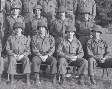 First Lt. Clinton S. Learn and Capt. Grandison K. Bienvenu are included in this portion of a photograph taken of the 112th Combat Engineer Battalion officers in France in August 1944. Learn is seated, second from the right and Bienvenu is standing second from the left. The Ohio National Guard Soldiers were among more than 160,000 Allied troops who landed along a 50-mile stretch of beach in Normandy on D-Day.