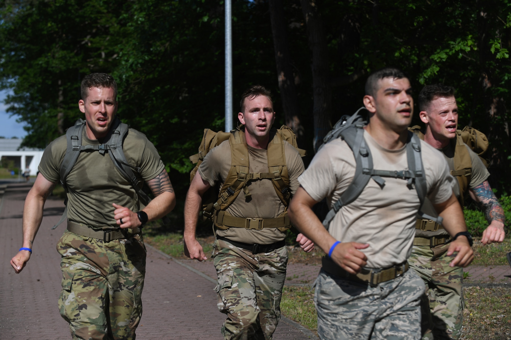 Members of the 435th Security Forces Squadron run during the Fourth Annual Chief Master Sgt. of the Air Force Paul Airey Memorial Ruck on Ramstein Air Base, Germany, May 31, 2019.