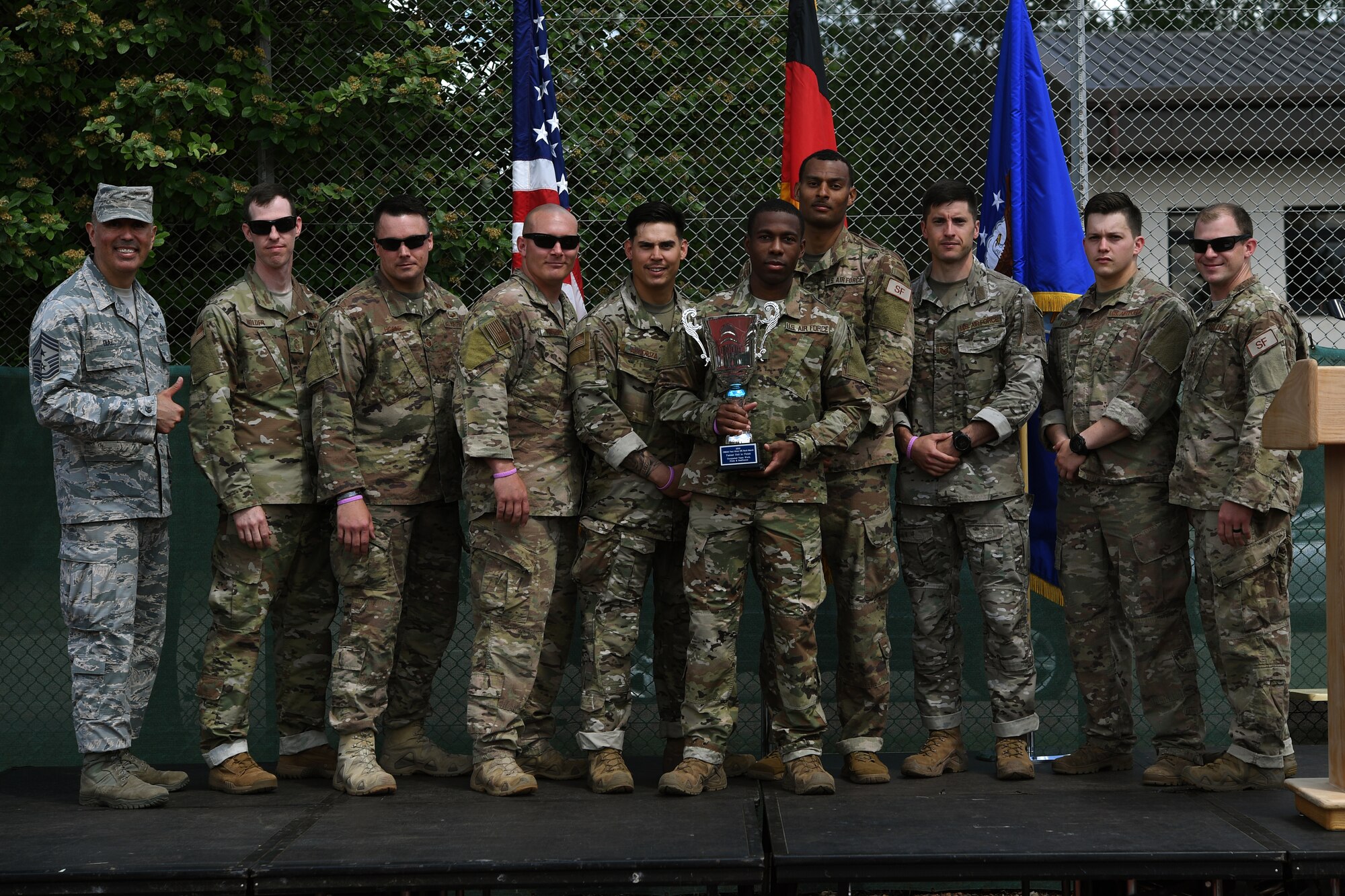 Members of the 435th Security Forces Squadron pose for a photo with Chief Master Sgt. Heriberto Diaz, 521st Air Mobility Operations Wing command chief, right, during the Fourth Annual Chief Master Sgt. of the Air Force Paul Airey Memorial Ruck on Ramstein Air Base, Germany, May 31, 2019.