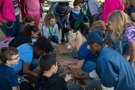 Booker Elementary School students separate oysters into groups at Joint Base Langley-Eustis, Virginia, June 3, 2019.