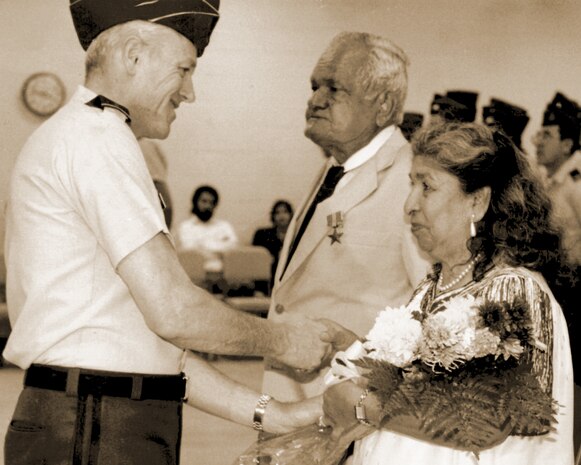 Photo of Jose G. San Miguel being presented Bronze Star by Maj. Gen. Ralph O. Doughty.