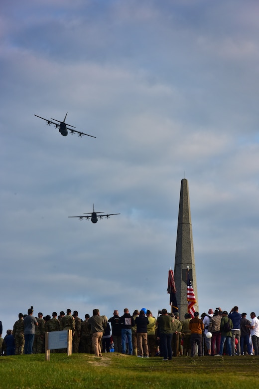 Two C-130s fly in the air