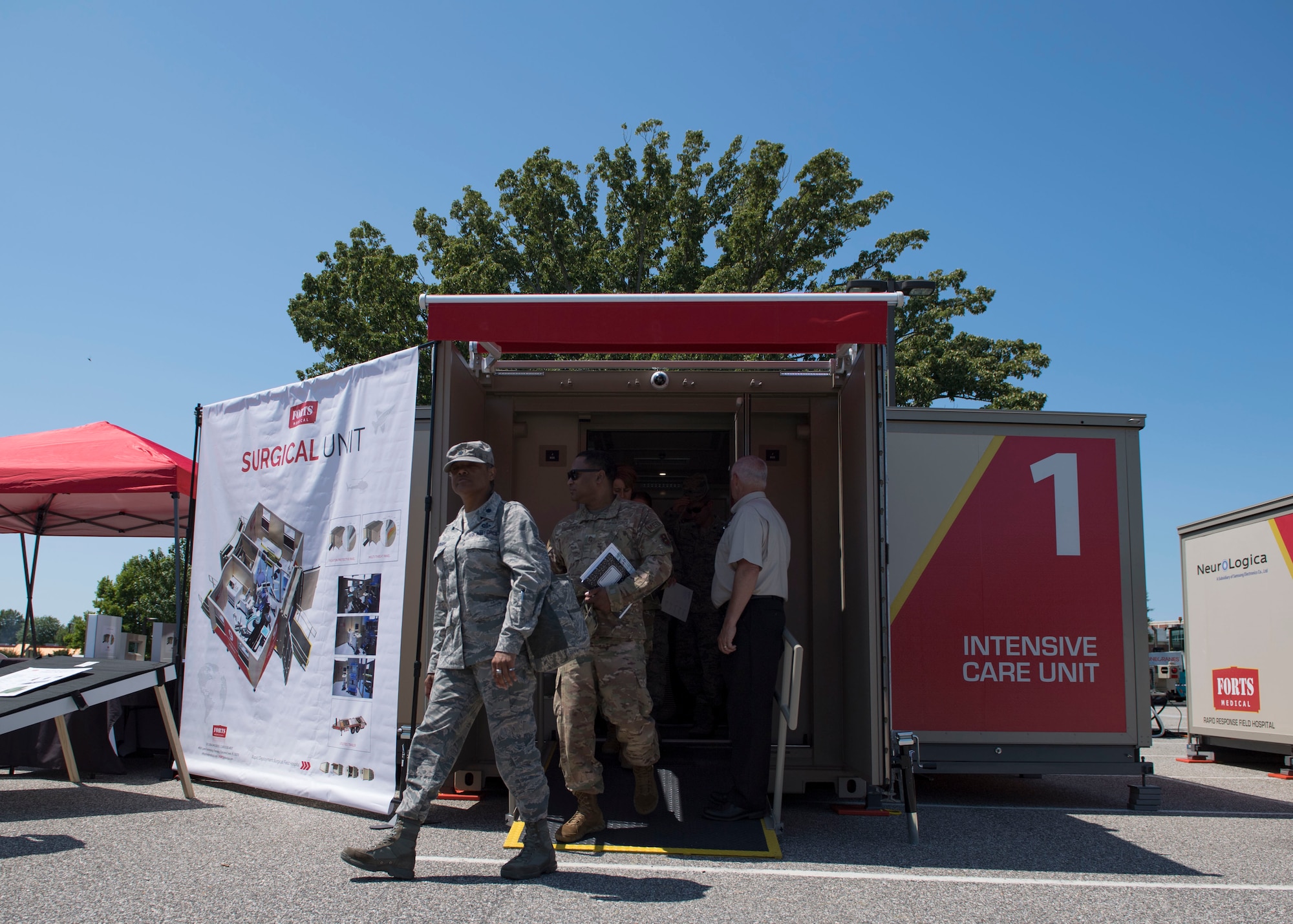 Members from various U.S. Air Force major commands exit a mobile surgical unit display at Joint Base Langley-Eustis, Virginia, June 4, 2019.