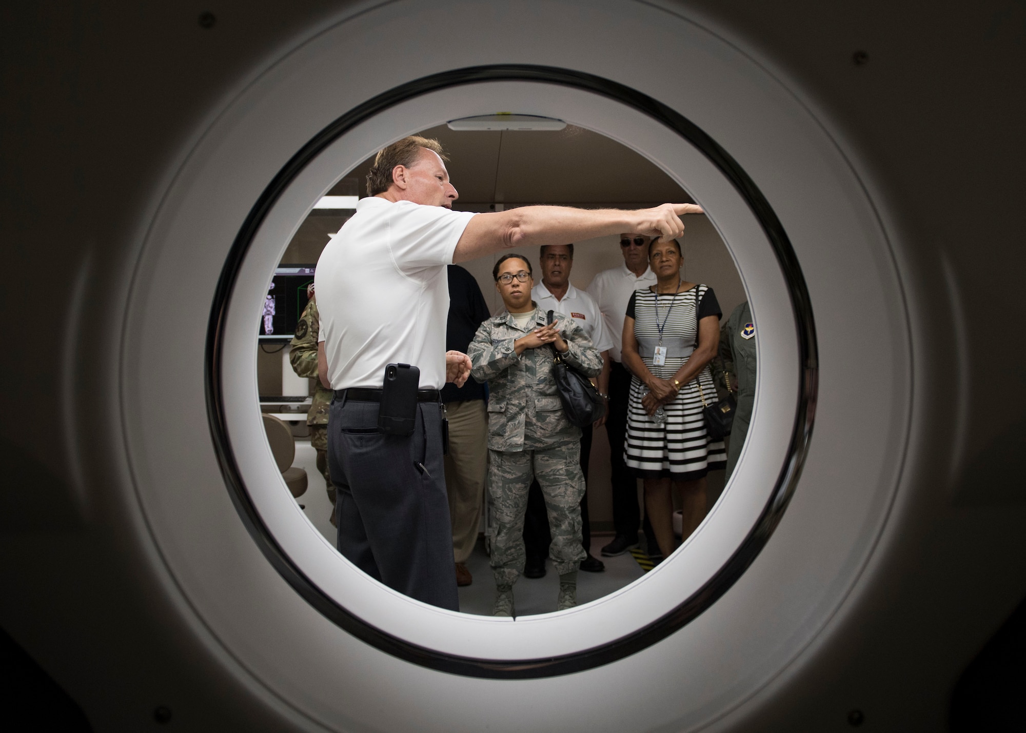 A medical equipment company representative highlights computed tomography scan unit features during the Manpower and Equipment Force Packaging Summit at Joint Base Langley-Eustis, Virginia, June 4, 2019.