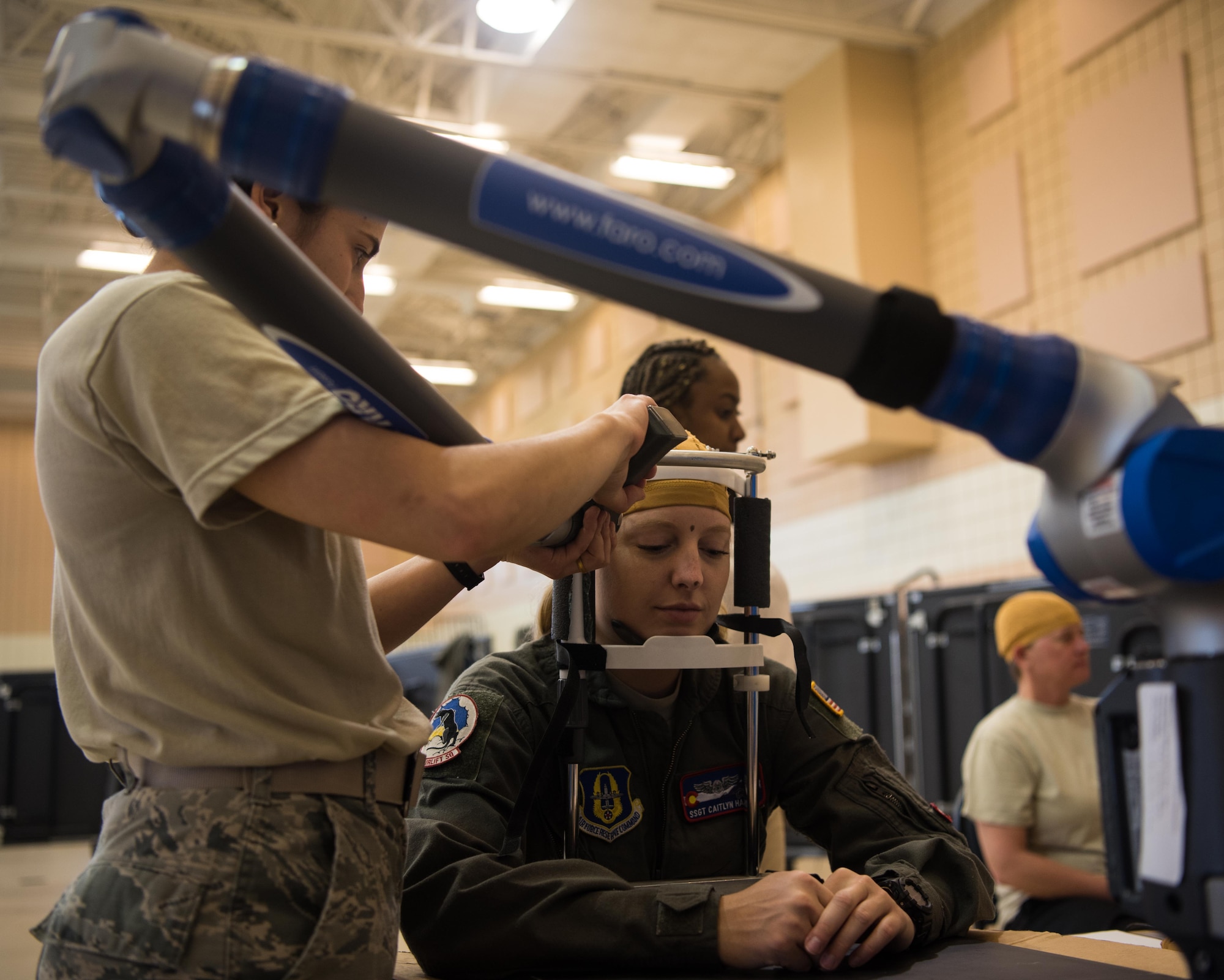 A U.S. Air Force Airman gets her head measured at the Female Fitment Event at Joint Base Langley-Eustis, Virginia, June, 4, 2019. The event allowed female aviators the chance to have their measurements taken and used for the designing of female flight equipment prototypes. (U.S. Air Force photo by Airman 1st Class Marcus M. Bullock)