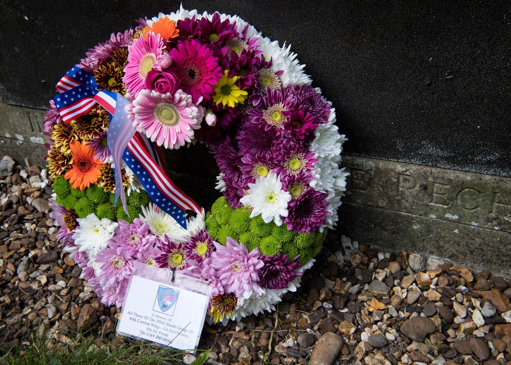 A reverend with the St. John the Baptist Chelveston Church in Chelveston, England, provides a religious service to include Airmen from the 305th Air Mobility Wing, Joint Base McGuire-Dix-Lakehurst, New Jersey, May 26, 2019. The service, which payed respects to the 305th Bomb Group which has evolved into the 305th AMW, was a group of over 4,000 military members that fought in World War II to defend and attack against axis powers. (U.S. Air Force photo by Senior Airman Jake Carter)