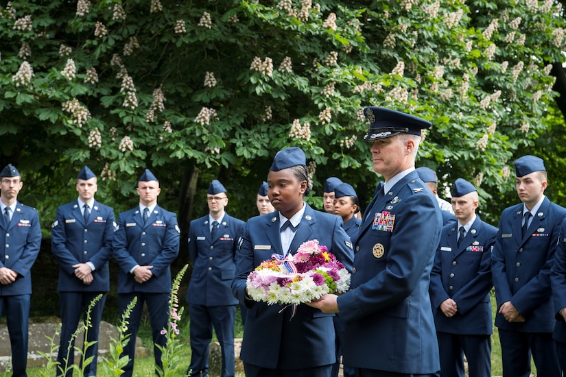 A reverend with the St. John the Baptist Chelveston Church in Chelveston, England, provides a religious service to include Airmen from the 305th Air Mobility Wing, Joint Base McGuire-Dix-Lakehurst, New Jersey, May 26, 2019. The service, which payed respects to the 305th Bomb Group which has evolved into the 305th AMW, was a group of over 4,000 military members that fought in World War II to defend and attack against axis powers. (U.S. Air Force photo by Senior Airman Jake Carter)