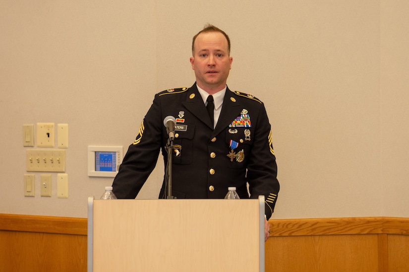 Sgt.1st Class Greg Waters delivers remarks after receiving his award.