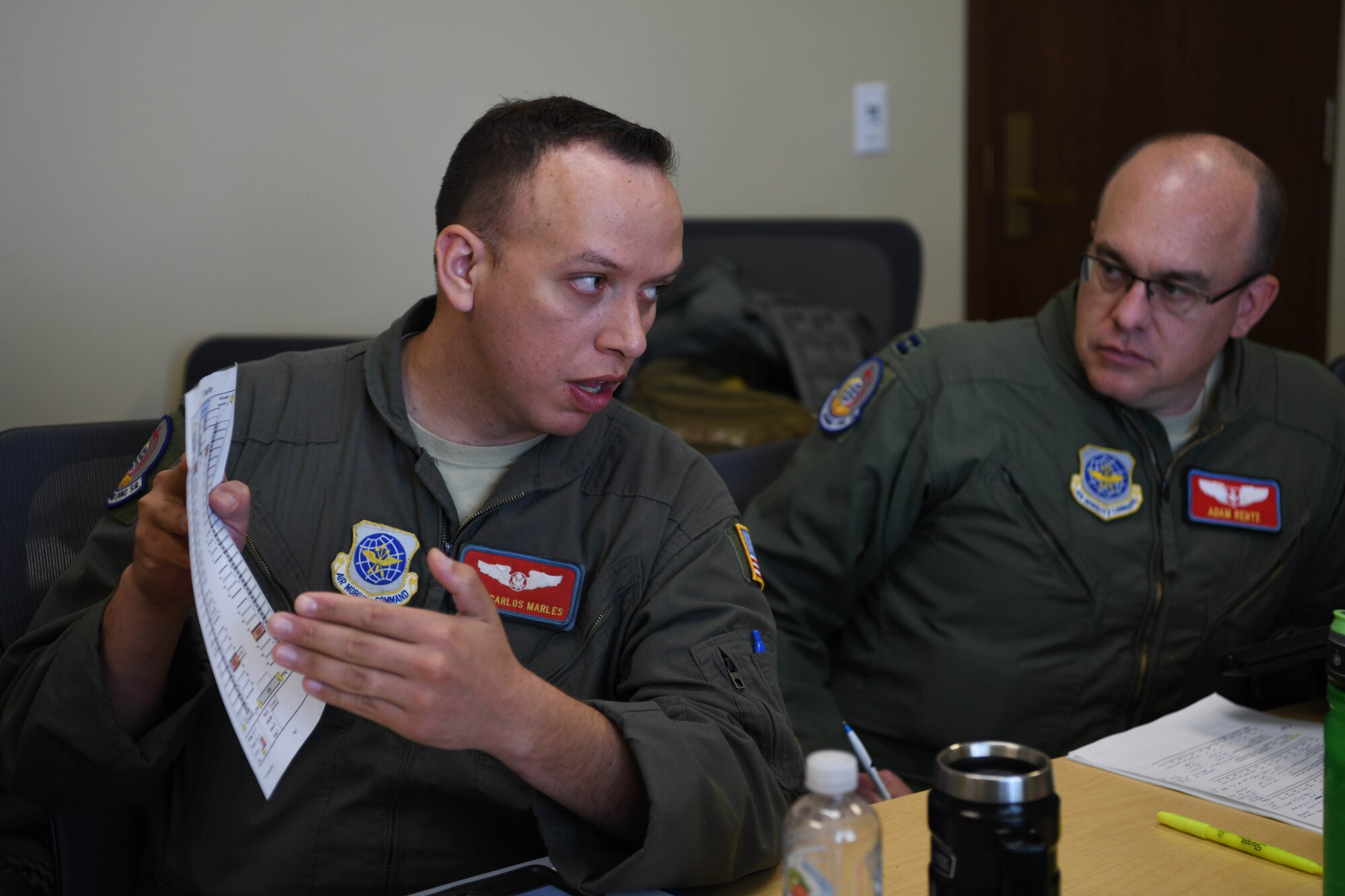 Airman shows information to another person