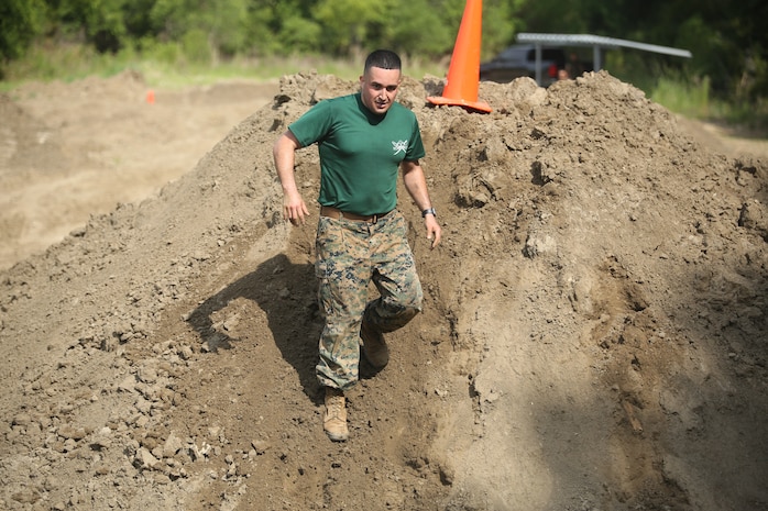 Staff Sgt. Nicholas Pavez cimbs down a hill during "Throwdown at Fightertown" aboard MArine Corps Air Station Beaufort, May 31. Pavez is a drill instructor with support battalion aboard Marine Corps Recruit Depot Parris Island.
