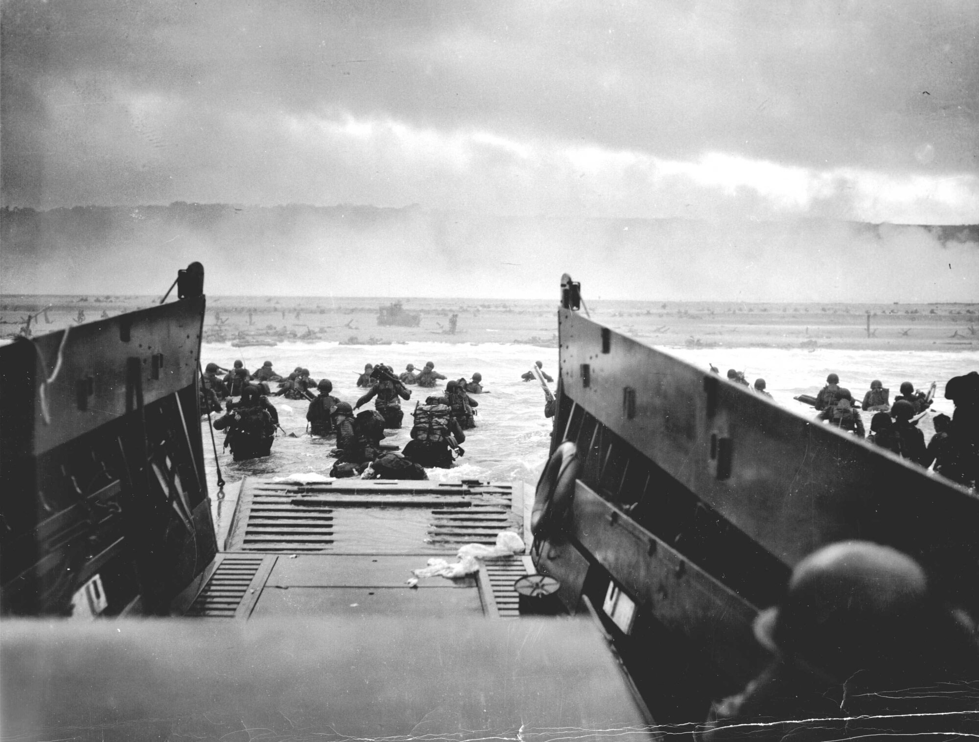 Assault landing, one of the first waves at Omaha. The Coast Guard caption identifies the unit as Company E, 16th Infantry, 1st Infantry Division. (Photo courtesy of Center of Military History)