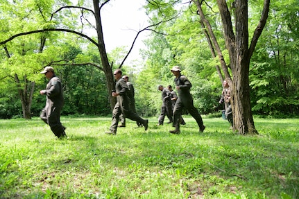 Airmen assigned to the 105th Airlift Wing participate in combat survival training at Plum Point County Park, New Windsor, New York, June 1, 2019. The training equips aircrews with the skill necessary to survive in hostile environments.